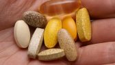 Hand-Supplements-Vitamins