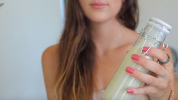 girl holding homemade shampoo