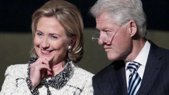 U.S. Secretary of State Hillary Rodham Clinton, and former President Bill Clinton, listen to speakers during a memorial service for Richard Holbrooke at the Kennedy Center, Friday, Jan. 14, 2011, in Washington.  Holbrooke, veteran US diplomat and Obama's special envoy to Afghanistan and Pakistan, died in December at the age of 69. (AP Photo/Carolyn Kaster)